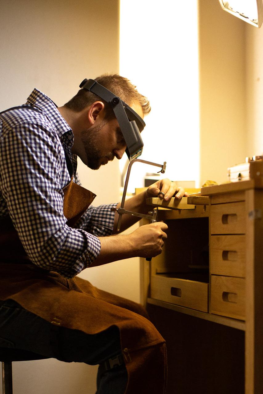 Mateo James at his silversmith bench
