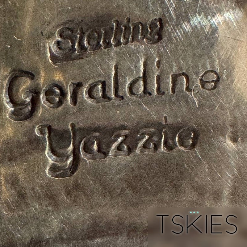 Hallmark of Geraldine Yazzie (Navajo) — cursive script signature stamp reading Sterling / Geraldine Yazzie, photographed by T.Skies